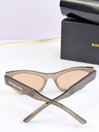 Balenciaga sunglasses, clear beige frame with light lenses, stacked