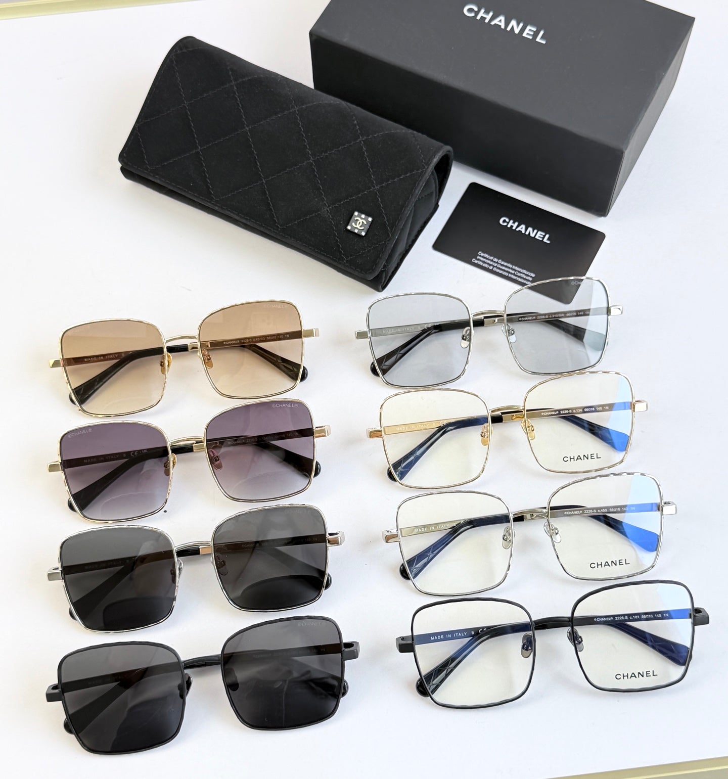Chanel eyeglasses assortment with black, gold, and tinted lenses in multiple frames
