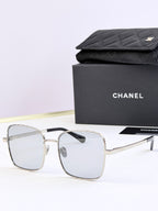 Chanel square eyeglasses with clear frames and light tinted lenses