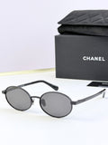 Chanel glasses with black round frames and dark gray lenses