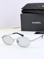 Chanel glasses with silver round frames and clear lenses
