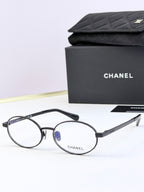 Chanel glasses with black round frames and clear lenses