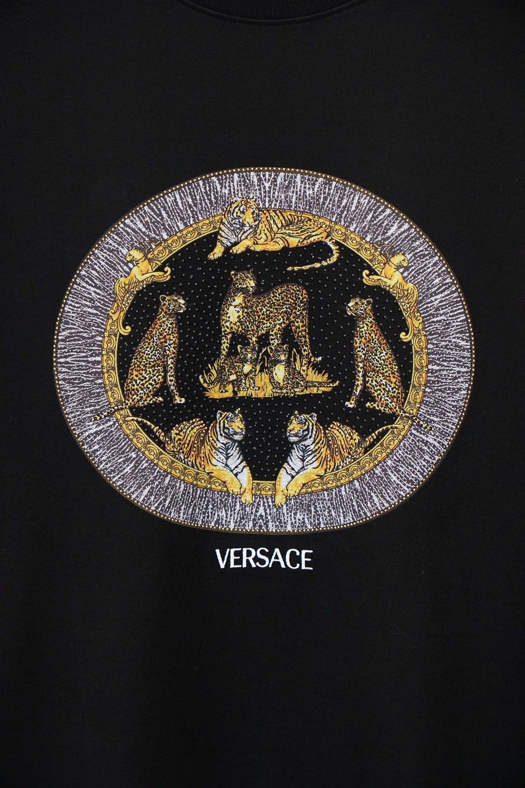 Black Versace crewneck T-shirt with gold emblem graphic and VERSACE text
