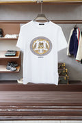 White Versace crewneck T-shirt with gold emblem graphic on the chest