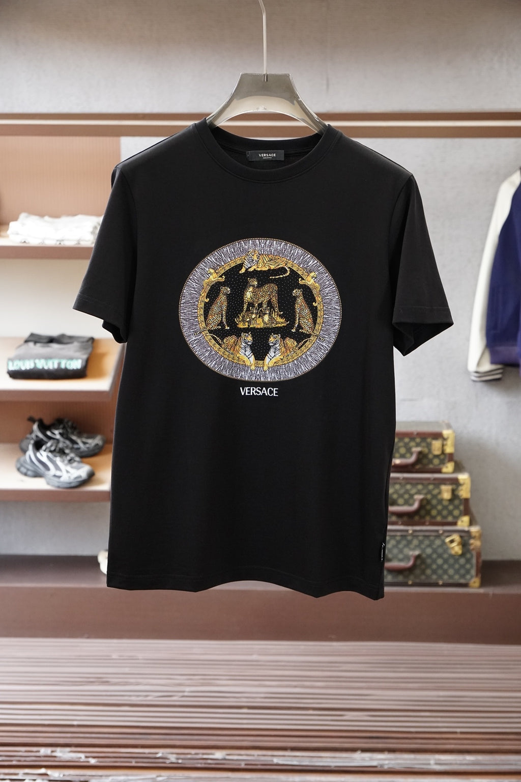 Black Versace crewneck T-shirt with large gold and silver emblem logo