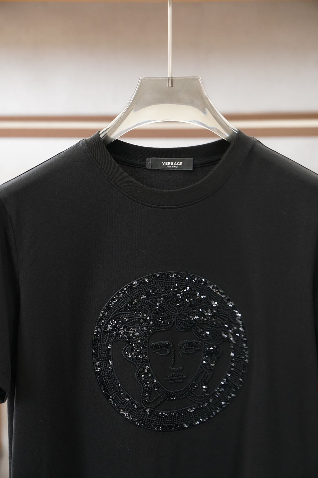 Versace black crewneck T-shirt with large circular embellished Medusa logo