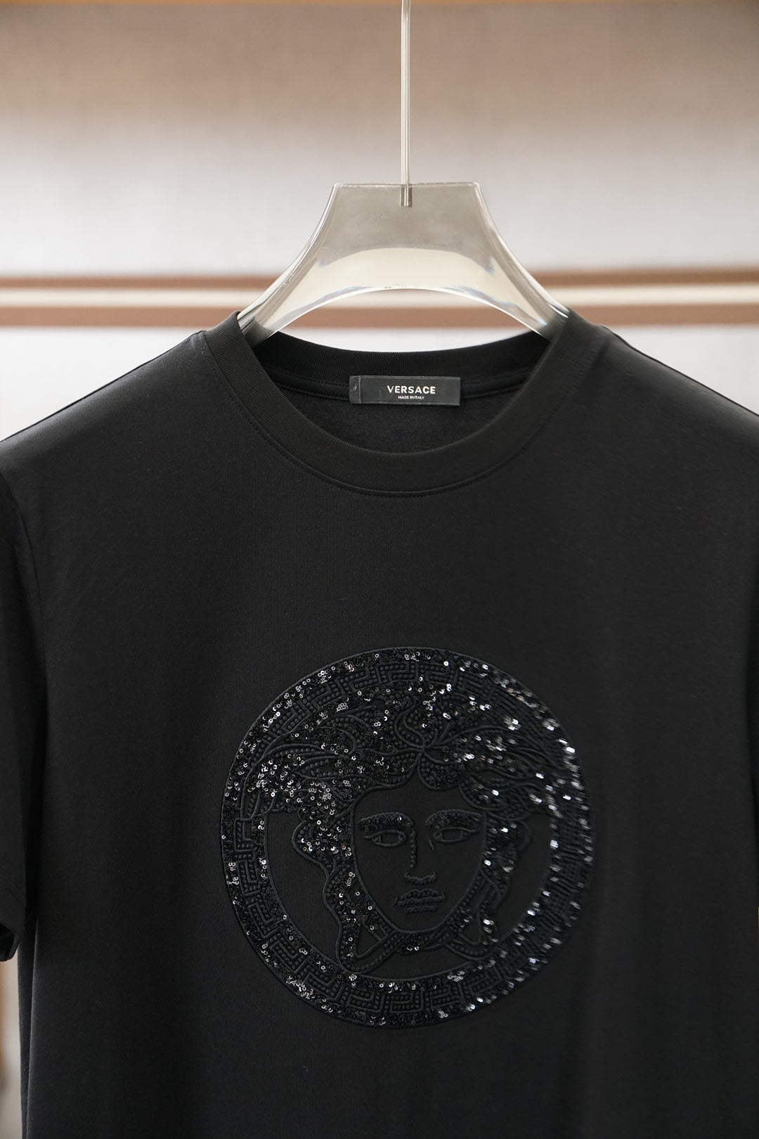Versace black crewneck T-shirt with large circular embellished Medusa logo