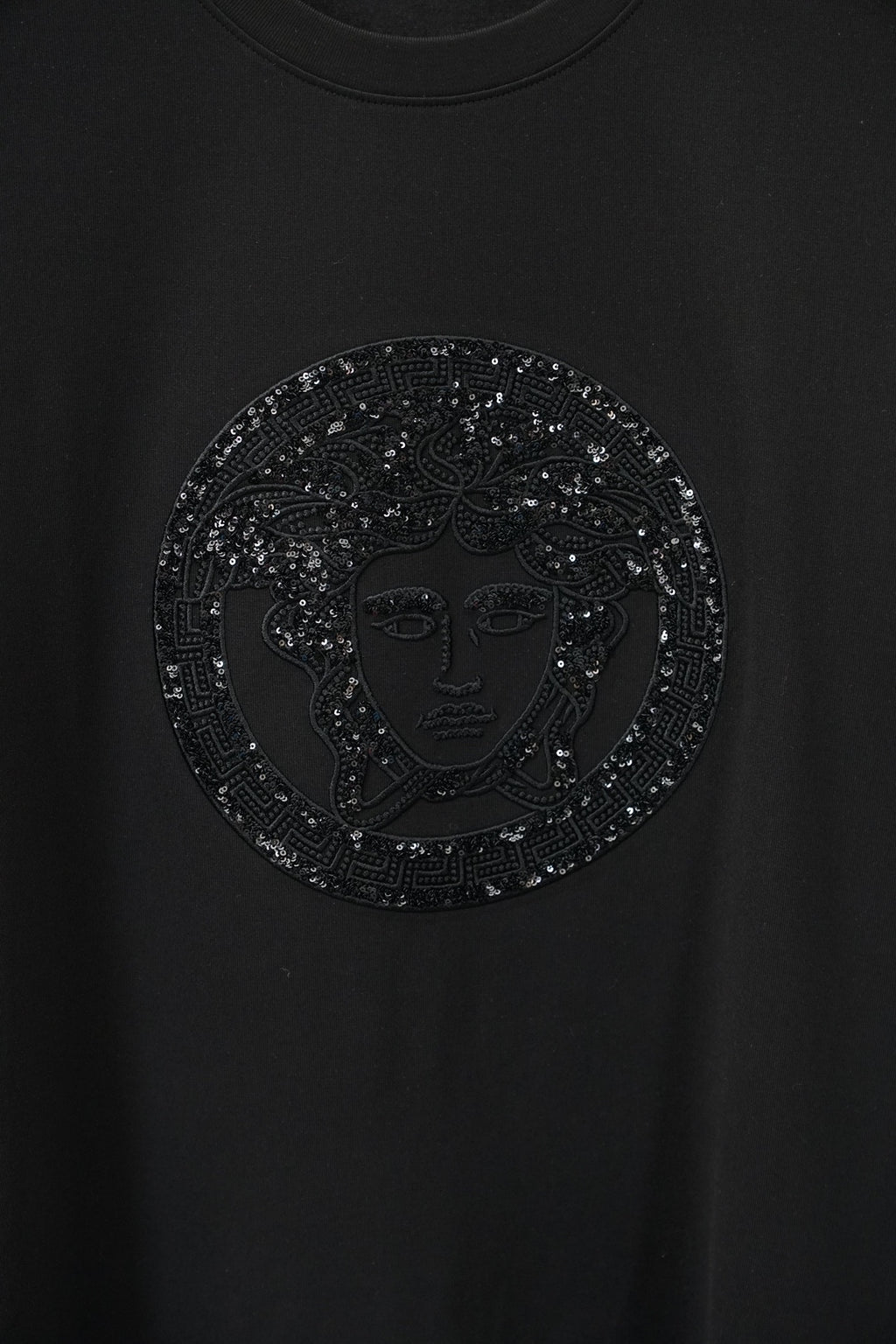 Versace black T-shirt with close-up circular rhinestone Medusa emblem