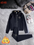 Black hooded zip-up jacket and matching jogger pants set, drawstring waistband