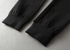 Black jogger pant hems with elastic cuffs, seam detail on cuffs