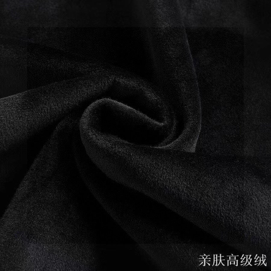 Black fleece fabric close-up with soft brushed texture