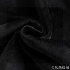 Black fleece fabric close-up with soft brushed texture