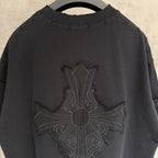 Black short-sleeve T-shirt close-up of large cross embroidery on back