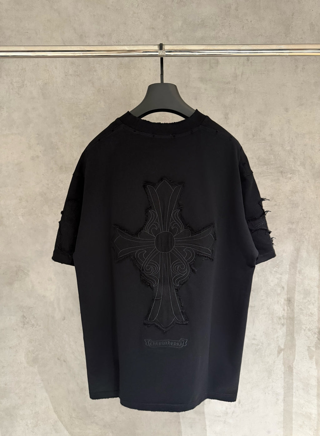 Black short-sleeve T-shirt with large cross graphic embroidery on back