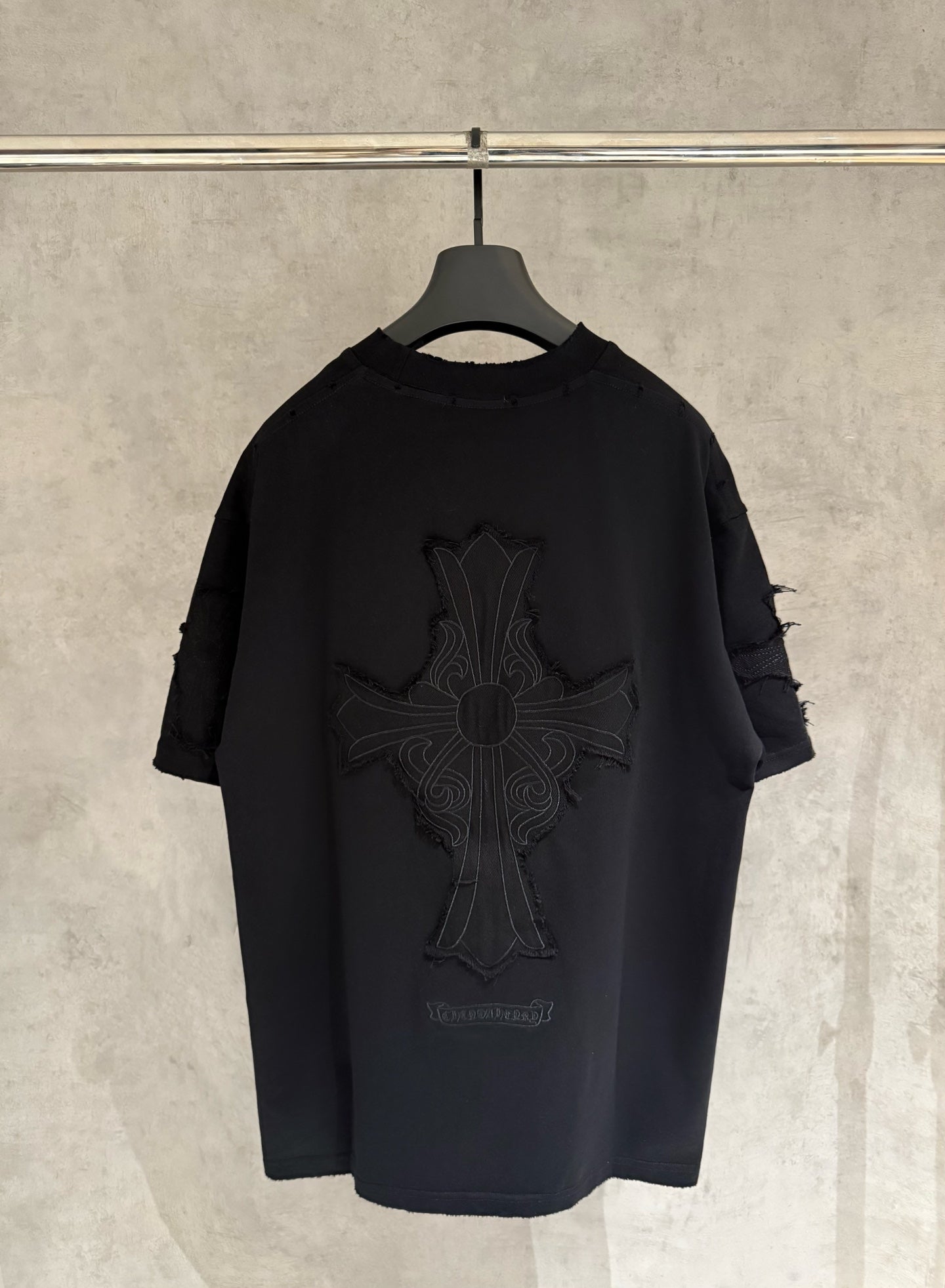 Black short-sleeve T-shirt with large cross graphic embroidery on back