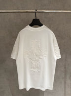 White short-sleeve T-shirt with large embroidered cross design on the back