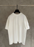 White short-sleeve T-shirt with large embroidered cross design on the chest