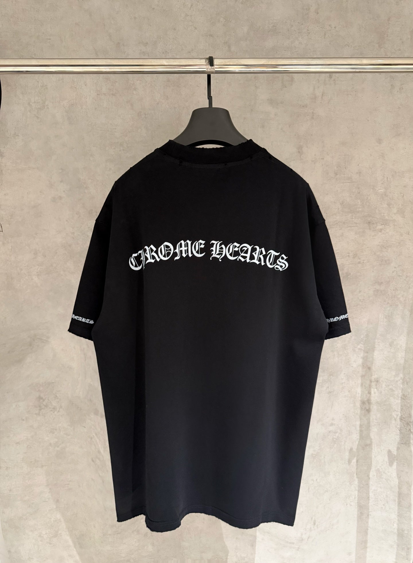 Black short-sleeve T-shirt with large back graphic text