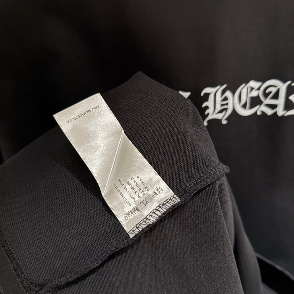 Black short-sleeve T-shirt with fabric care label at side seam