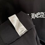 Black short-sleeve T-shirt with fabric care label at side seam