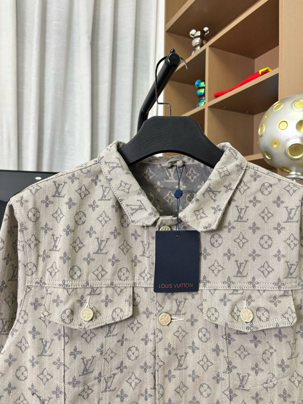 Louis Vuitton monogram long-sleeve jacket chest close-up with two pockets and navy tag