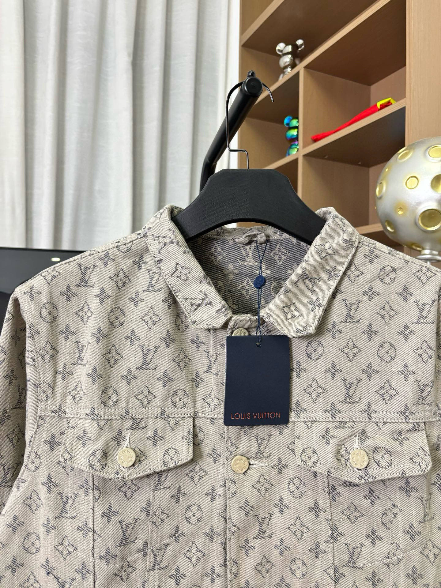 Louis Vuitton monogram long-sleeve jacket chest close-up with two pockets and navy tag