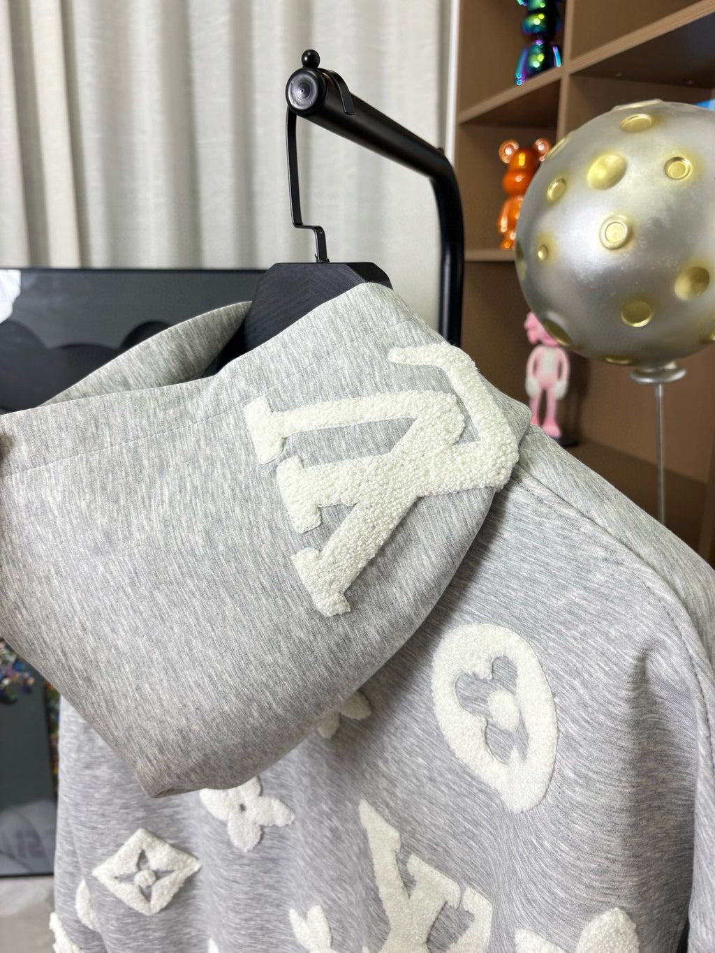 Louis Vuitton gray heather hoodie with hood, long sleeves, and monogram-style motifs