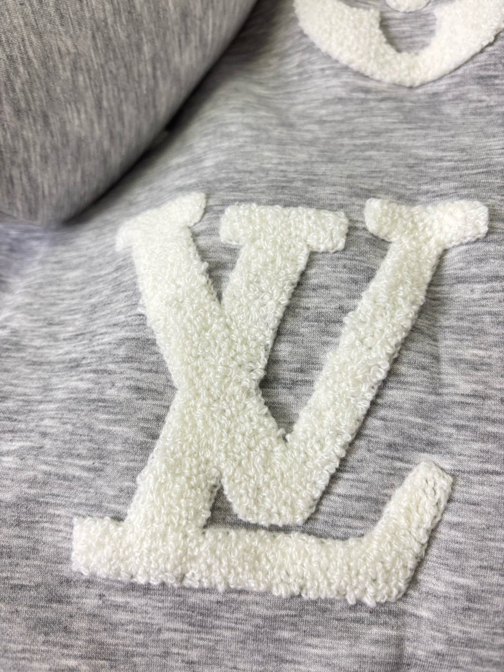 Louis Vuitton gray heather fabric with raised cream LV-style monogram print
