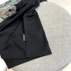 Versace black T-shirt hem with small interior neck label