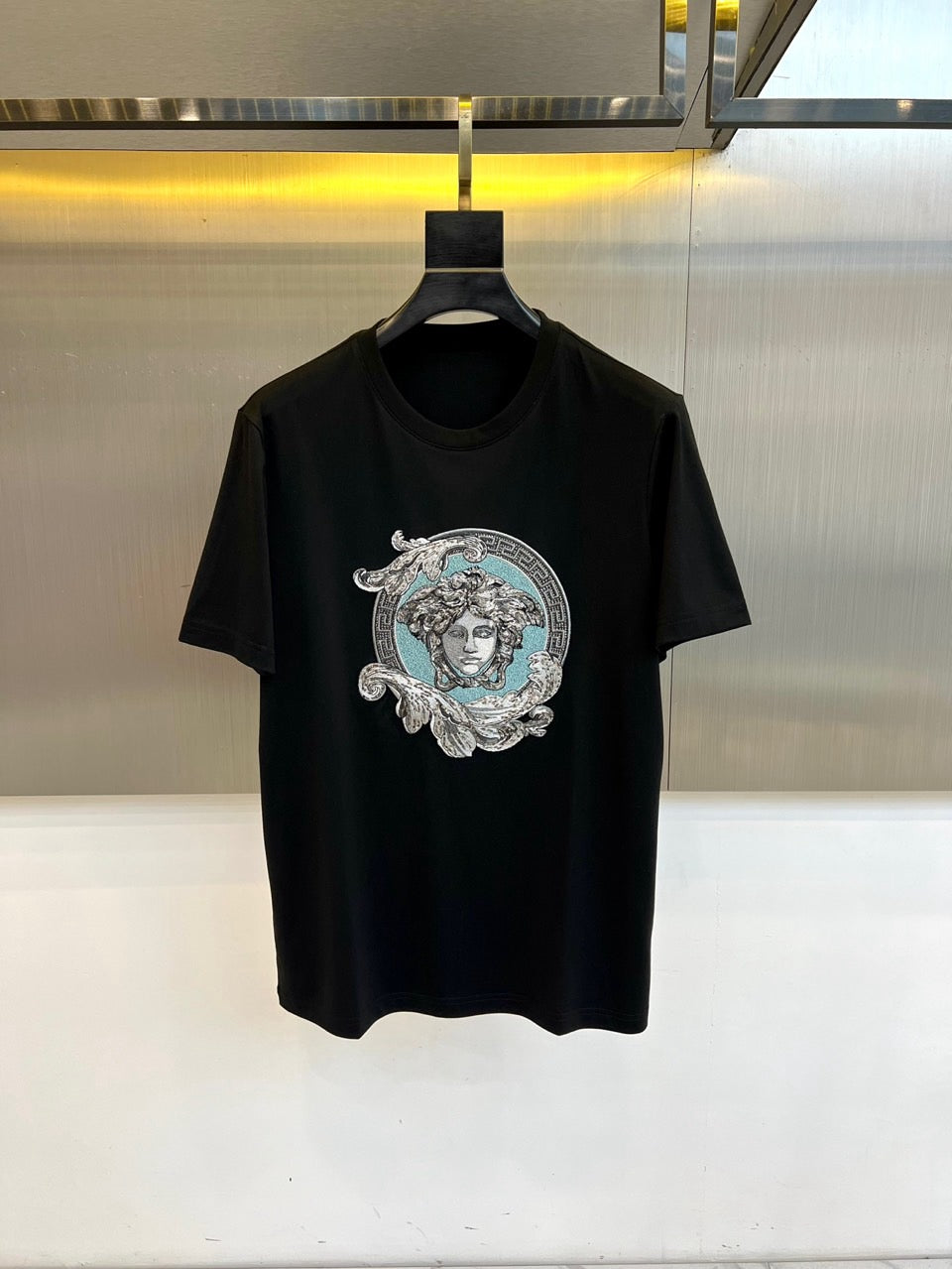 Versace black T-shirt with large Medusa face graphic on the chest