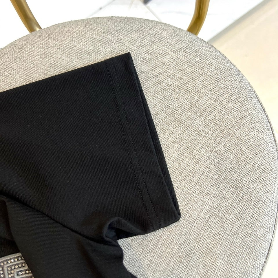 Versace black T-shirt sleeve and side seam detail
