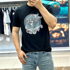 Versace black T-shirt with Medusa face print, worn with light blue jeans