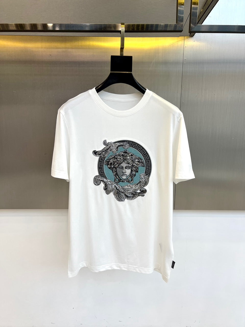 White Versace T-shirt with teal Medusa front graphic