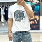White Versace T-shirt on model, teal Medusa chest graphic