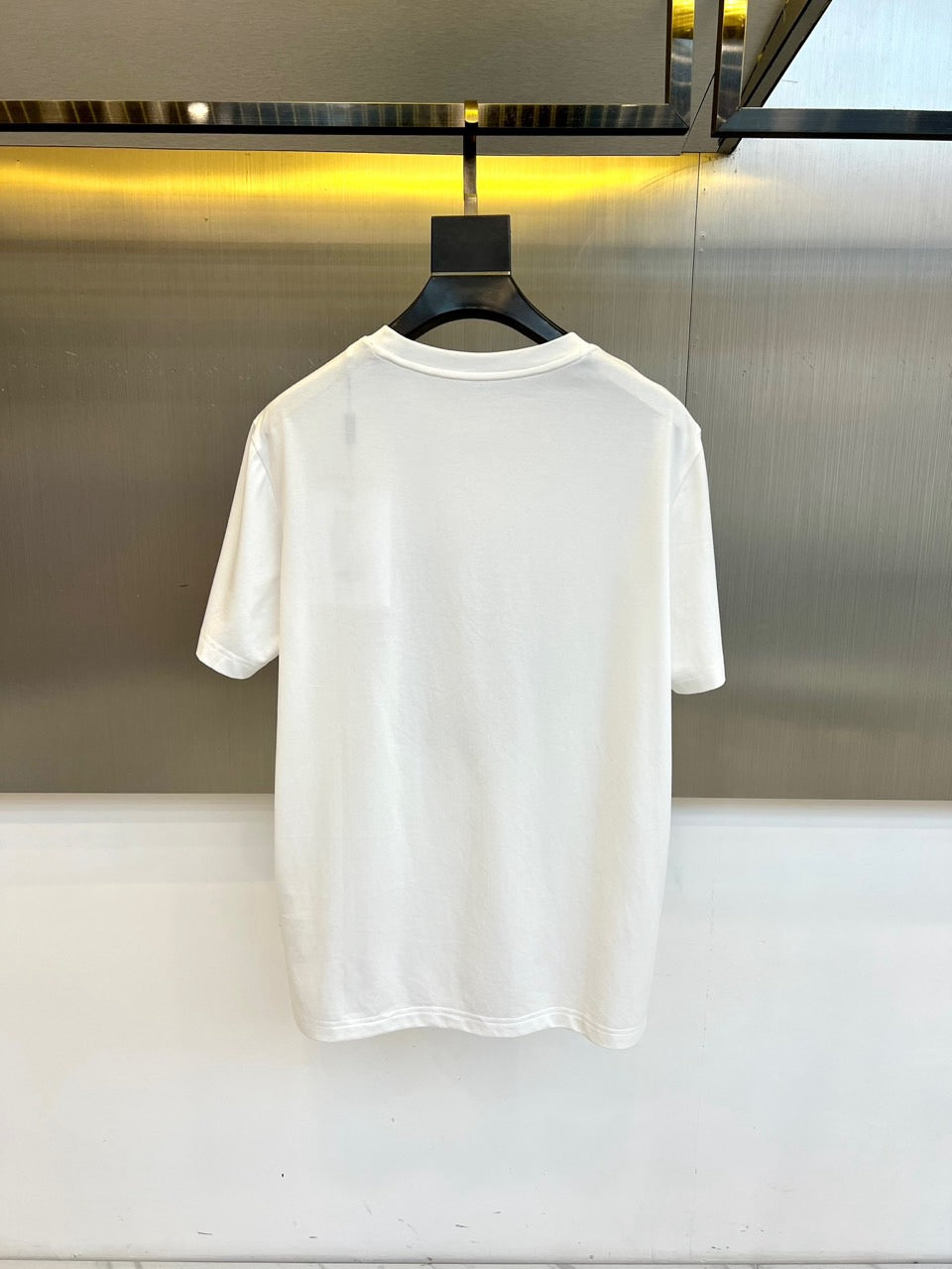 White Versace T-shirt back view on hanger