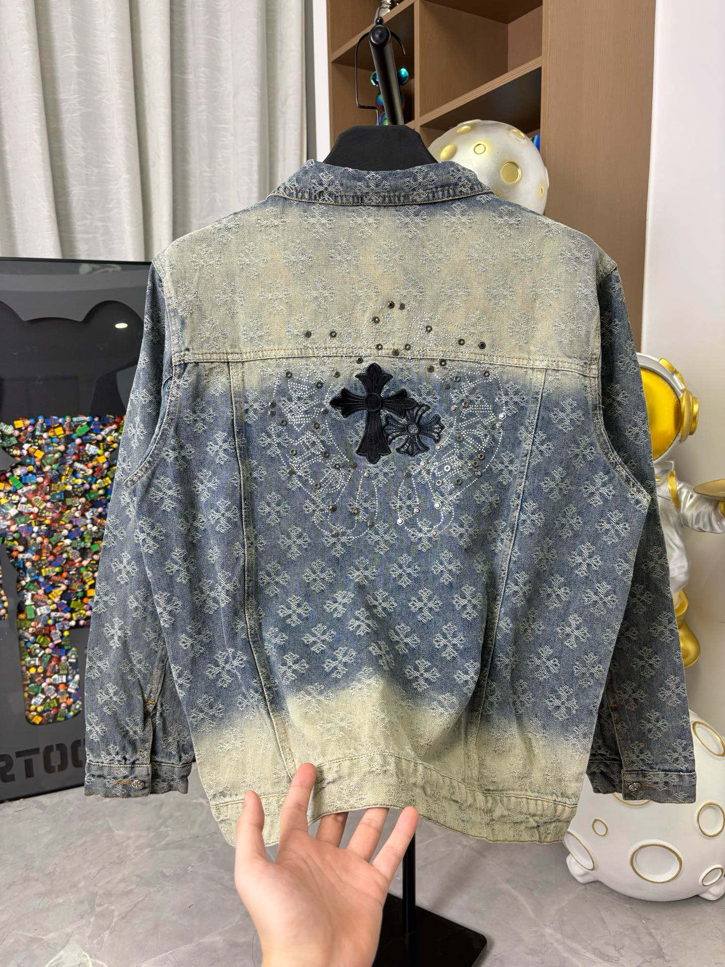 Long-sleeve denim jacket back, blue wash with cross appliques and bead-studded details