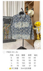 Louis Vuitton denim jacket front full view with blue wash and gold monogram pattern on hanger.