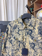 Long-sleeve jacket front view with button placket and blue-and-cream print