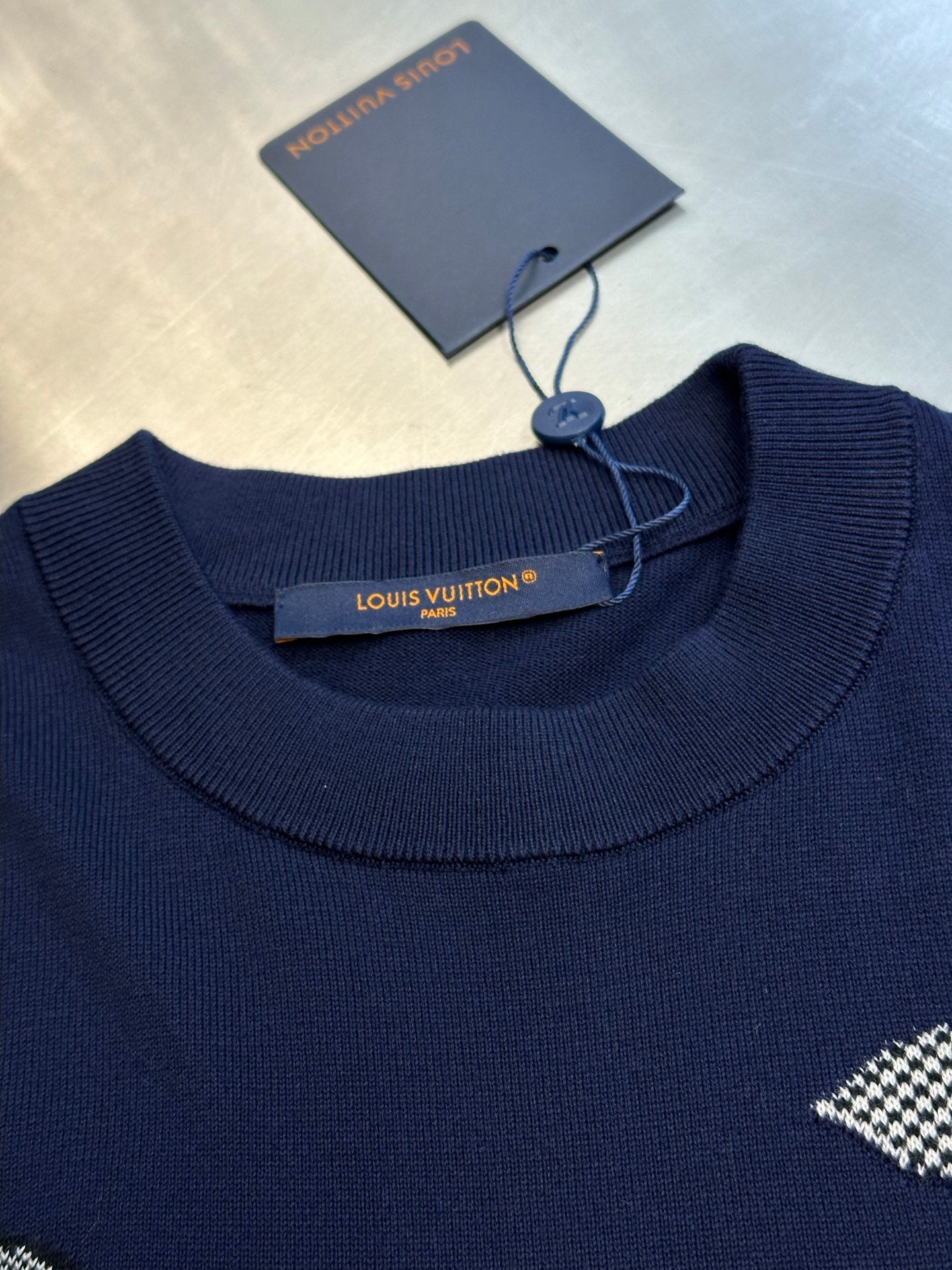 Navy ribbed crew neckline T-shirt with Louis Vuitton tag and rhinestone design