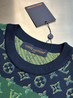 Crew neck collar with navy trim and green monogram knit label