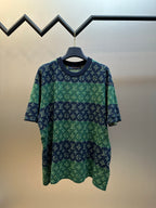 Knit short-sleeve top with navy and green allover monogram pattern