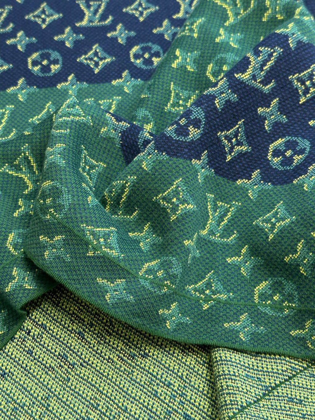 Knit hem and allover monogram pattern in green with navy and yellow accents