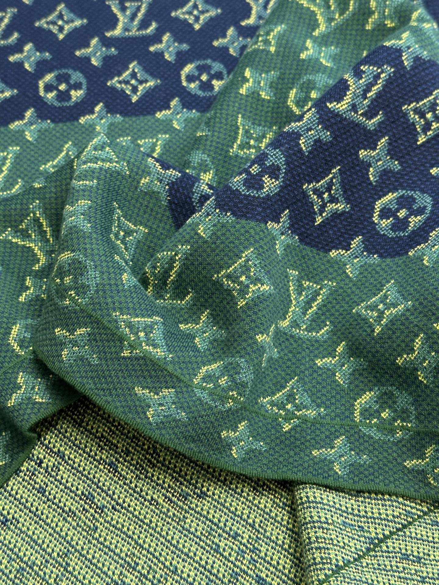 Knit hem and allover monogram pattern in green with navy and yellow accents