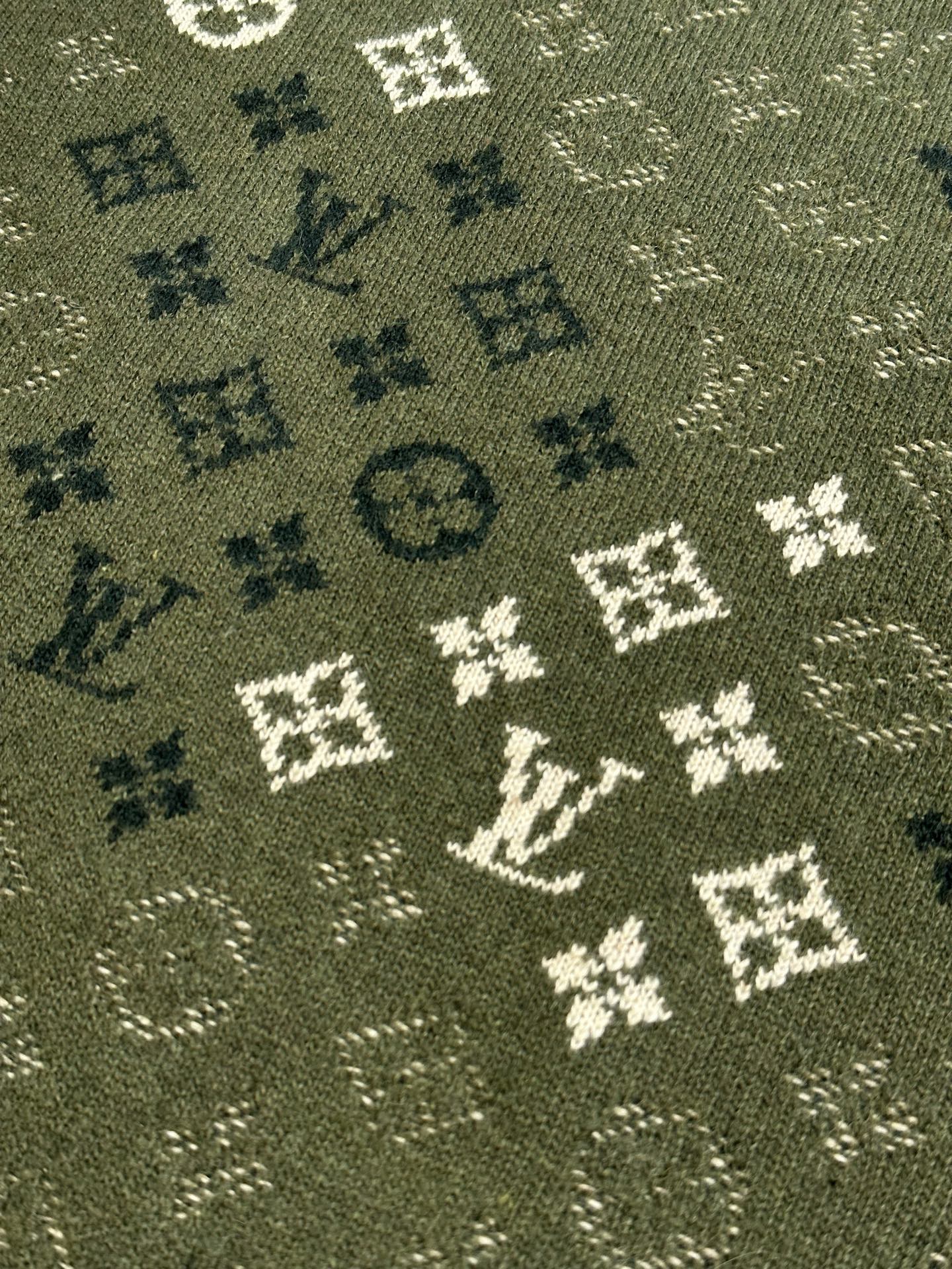 Louis Vuitton knit sweater fabric close-up in olive green with monogram pattern