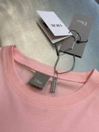 Light pink Dior crew-neck T-shirt with attached size and brand tags