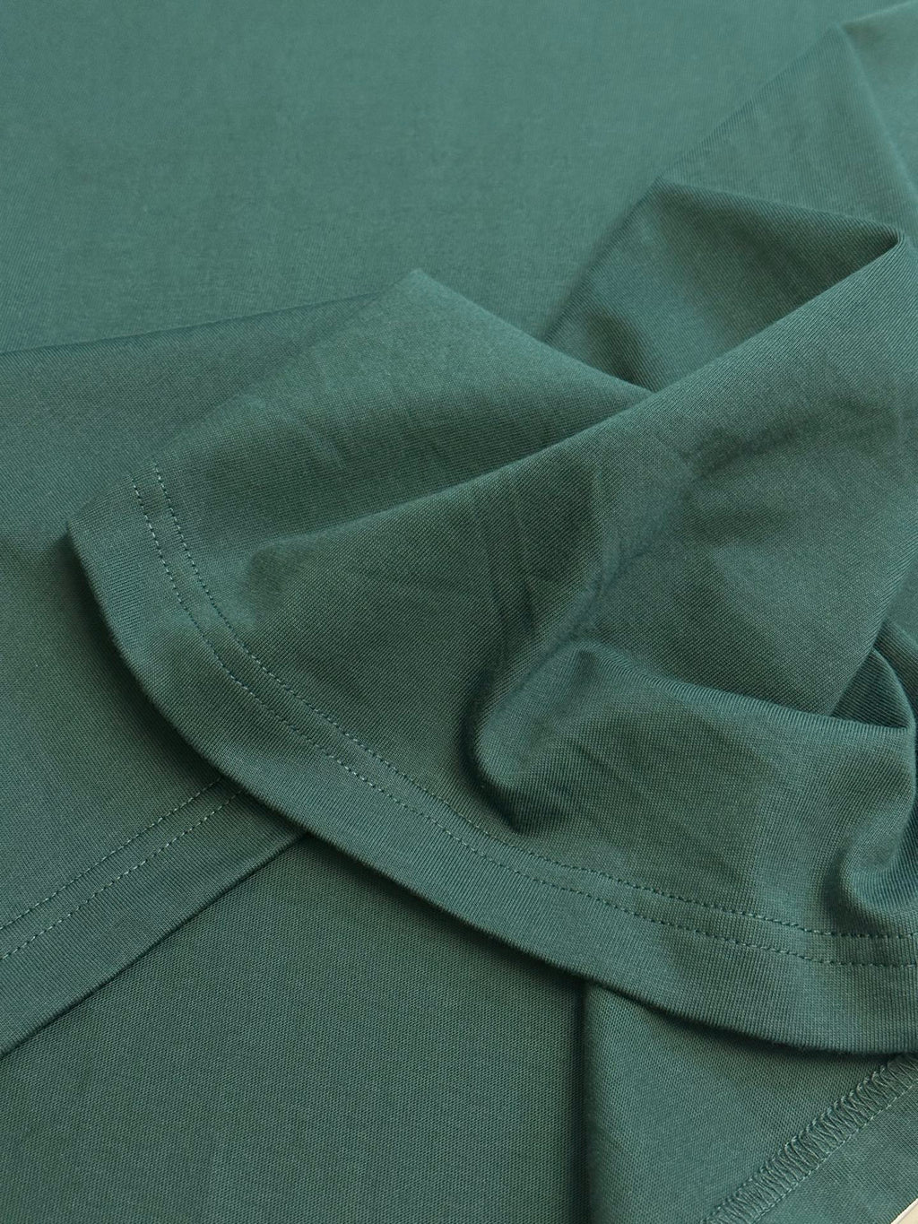 Dark green Dior short-sleeve T-shirt sleeve cuff and stitched hem detail