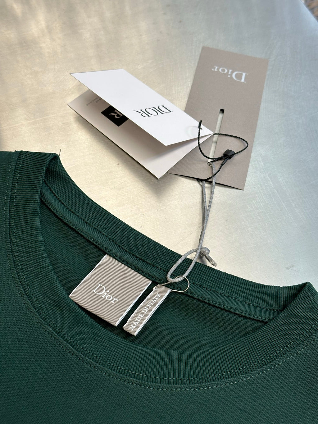 Dior dark green short-sleeve T-shirt neckline with brand tag attached