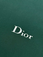 Dior logo detail on green T-shirt fabric