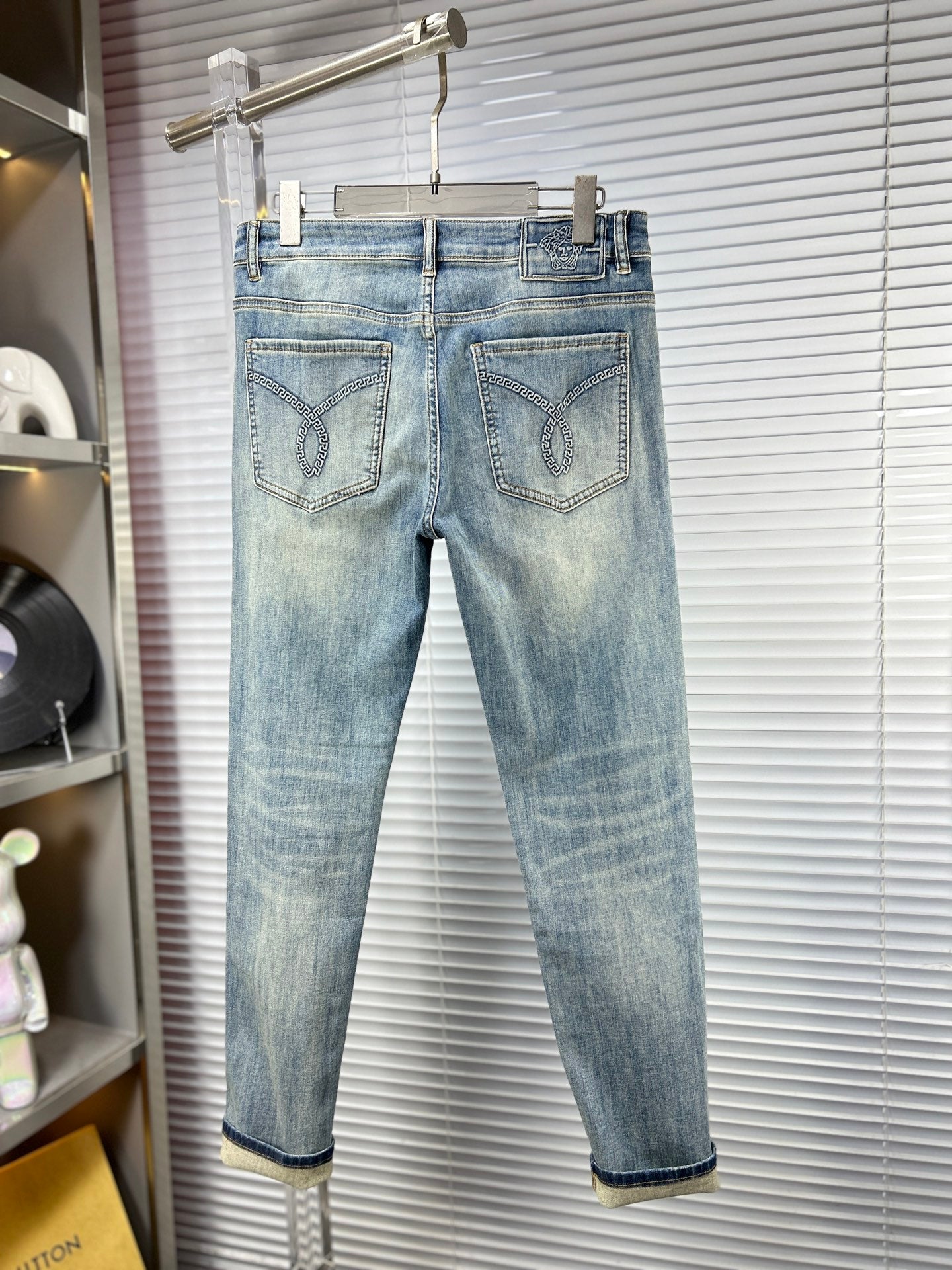 Light blue washed denim jeans with two front pockets and belt loops