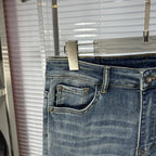 Light blue denim jeans with front coin pocket and stitched pocket edges